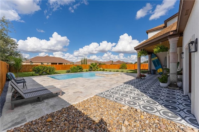 view of swimming pool with a patio area