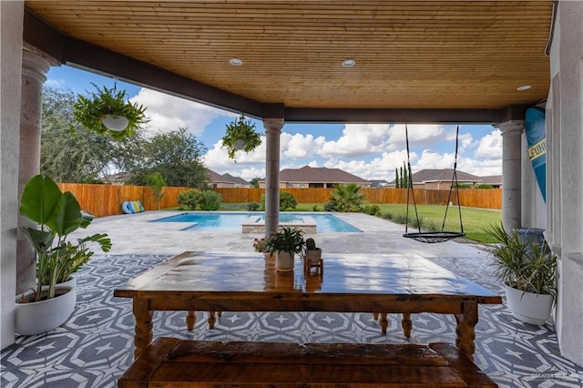 view of patio with a fenced in pool