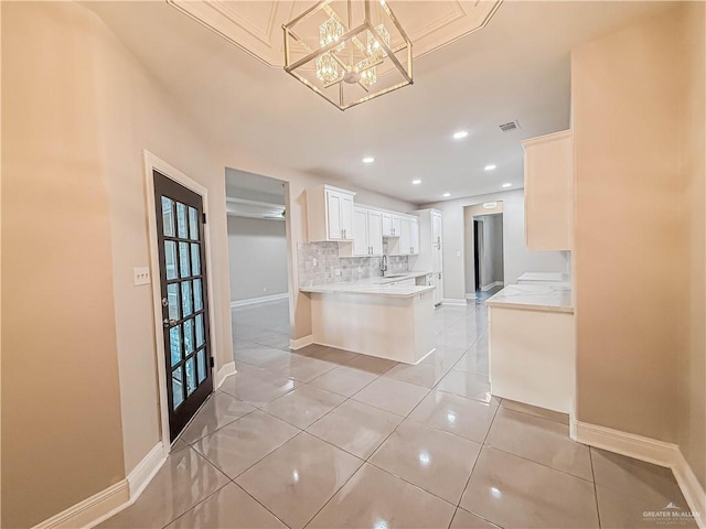 2817 Bluebird Ave, Mcallen, TX 78504 - kitchen featuring backsplash, light countertops, baseboards, recessed lighting, and white cabinets