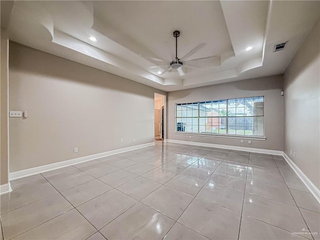 2817 Bluebird Ave, Mcallen, TX 78504 - unfurnished room with a tray ceiling, ceiling fan, baseboards, recessed lighting, and light tile patterned floors