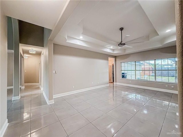 2817 Bluebird Ave, Mcallen, TX 78504 - unfurnished room with a tray ceiling, ceiling fan, light tile patterned floors, baseboards, and recessed lighting