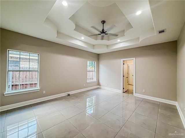 2817 Bluebird Ave, Mcallen, TX 78504 - empty room featuring a ceiling fan, a raised ceiling, recessed lighting, baseboards, and light tile patterned floors
