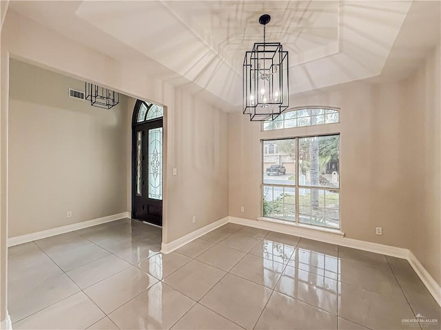 2817 Bluebird Ave, Mcallen, TX 78504 - unfurnished room featuring a chandelier, tile patterned flooring, and baseboards