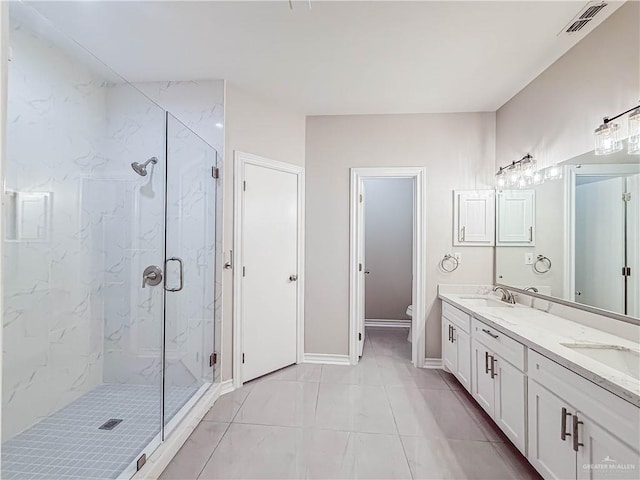 2817 Bluebird Ave, Mcallen, TX 78504 - full bathroom featuring a marble finish shower, toilet, double vanity, and baseboards