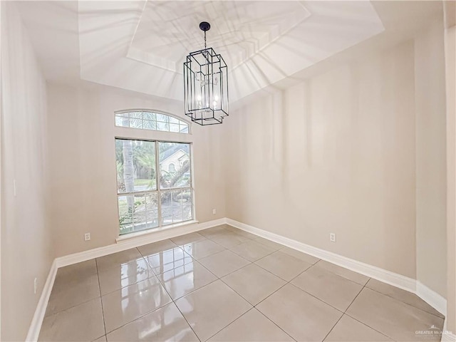 2817 Bluebird Ave, Mcallen, TX 78504 - tiled spare room with a chandelier and baseboards