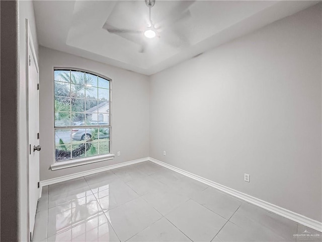 2817 Bluebird Ave, Mcallen, TX 78504 - tiled spare room featuring baseboards and a raised ceiling