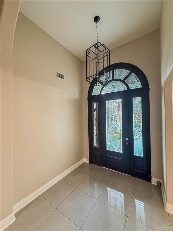 2817 Bluebird Ave, Mcallen, TX 78504 - entrance foyer featuring baseboards, tile patterned flooring, and a high ceiling