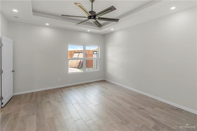 202 Constellation Dr E, Pharr, TX 78577 - unfurnished room with a raised ceiling, light wood finished floors, recessed lighting, and ceiling fan