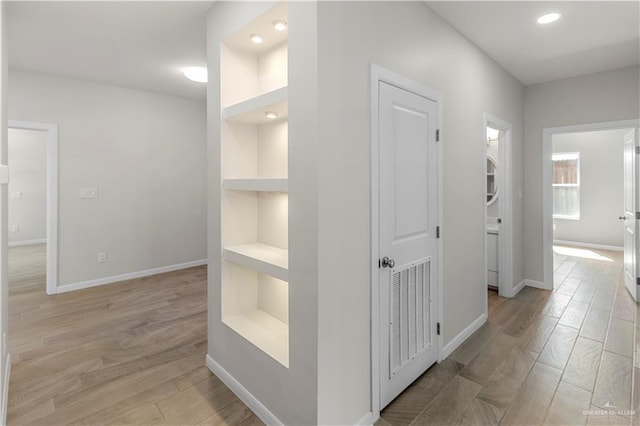 202 Constellation Dr E, Pharr, TX 78577 - corridor featuring built in shelves, light wood-style floors, and recessed lighting