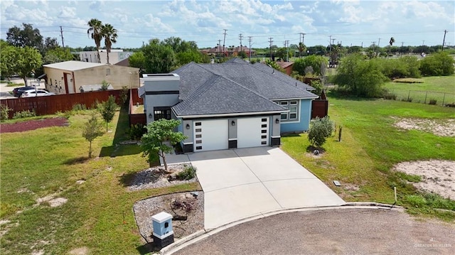 202 Constellation Dr E, Pharr, TX 78577 - view of front of property with concrete driveway, a garage, and roof with shingles