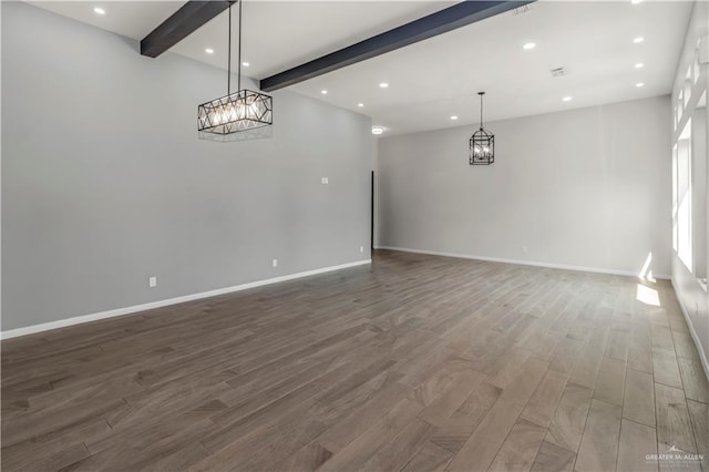 202 Constellation Dr E, Pharr, TX 78577 - spare room with beamed ceiling, wood finished floors, recessed lighting, and a chandelier