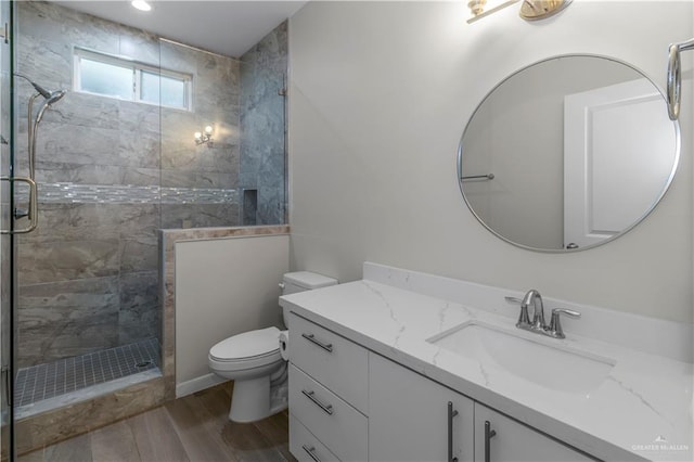 202 Constellation Dr E, Pharr, TX 78577 - bathroom with tiled shower, vanity, recessed lighting, and wood finished floors