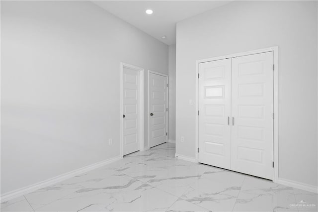 unfurnished bedroom with a closet