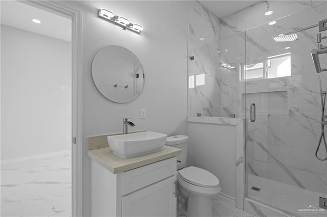 bathroom featuring toilet, an enclosed shower, and vanity