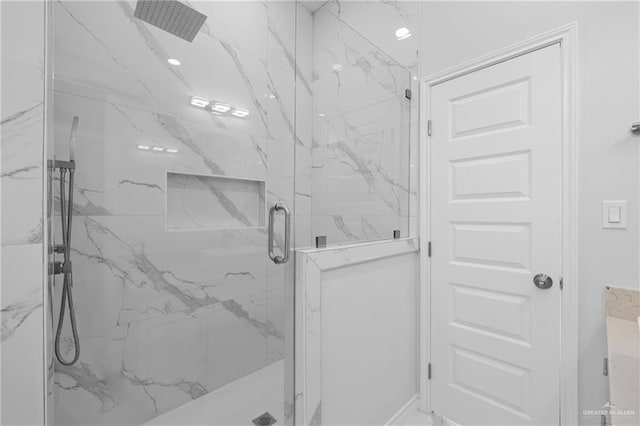 bathroom with an enclosed shower