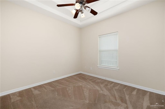 spare room with carpet and ceiling fan