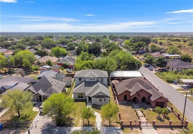 birds eye view of property with a residential view