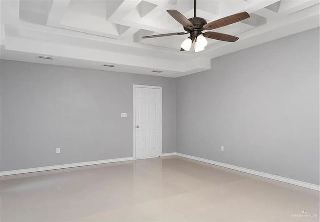 unfurnished room with visible vents, baseboards, coffered ceiling, and ceiling fan