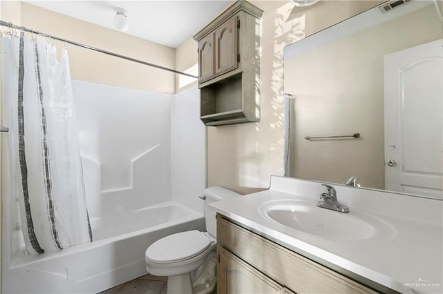 full bathroom featuring shower / bathtub combination with curtain, vanity, and toilet