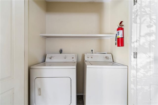 laundry room with separate washer and dryer