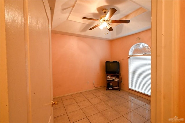 unfurnished room with ceiling fan and light tile patterned flooring