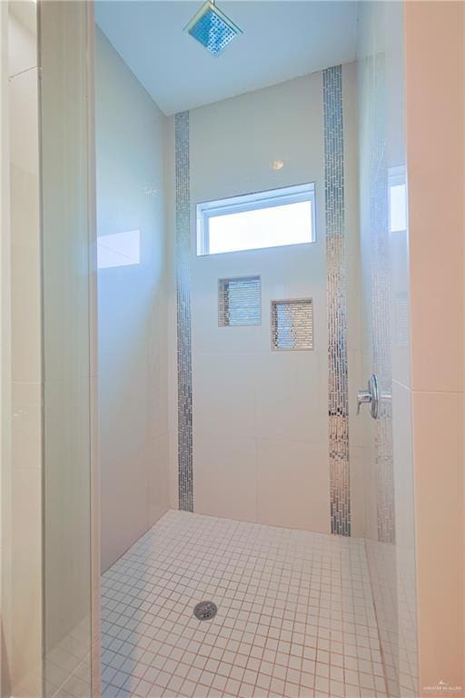 bathroom with tiled shower