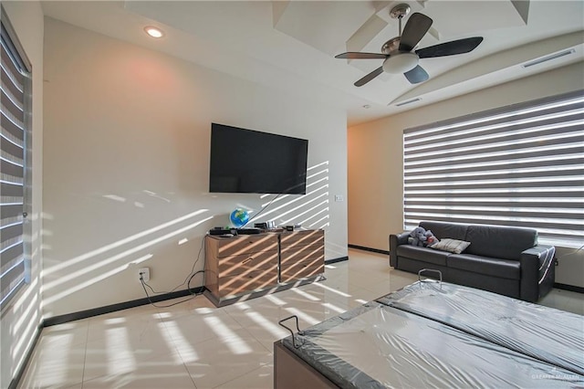 bedroom with ceiling fan and light tile patterned flooring