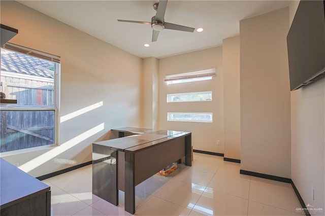 tiled home office with ceiling fan