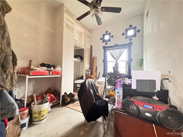 miscellaneous room featuring concrete floors and ceiling fan