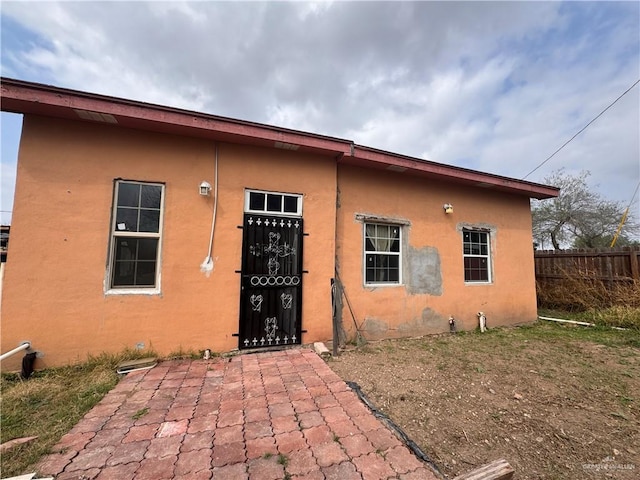 rear view of property featuring a patio area