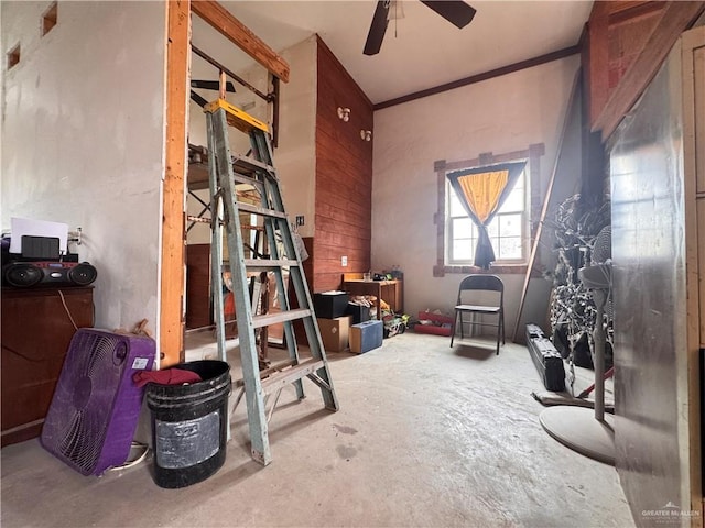 misc room featuring concrete flooring and ceiling fan