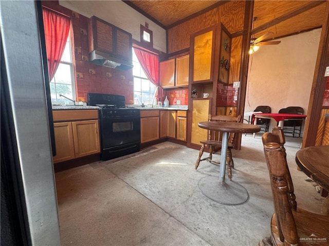 kitchen featuring concrete floors and black range with gas cooktop