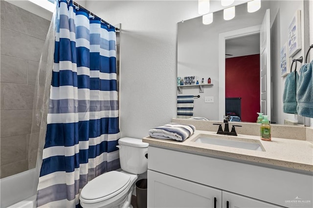 full bathroom with vanity, toilet, and shower / bath combo with shower curtain