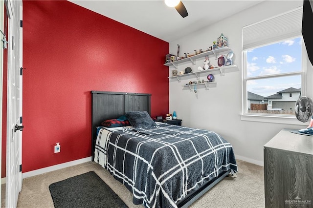 carpeted bedroom featuring ceiling fan