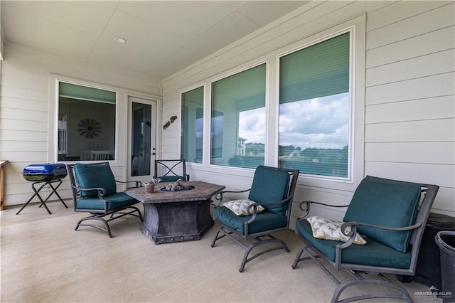 view of patio / terrace with a fire pit