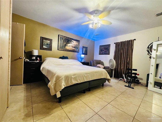 bedroom with light tile patterned flooring, visible vents, and ceiling fan