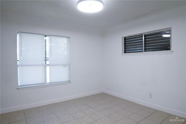 210 E Hurst St E, Harlingen, TX 78550 - empty room featuring baseboards and light tile patterned floors