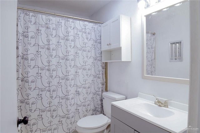 210 E Hurst St E, Harlingen, TX 78550 - full bathroom featuring toilet, vanity, and a shower with curtain