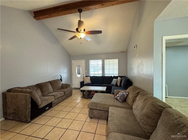 living area with a ceiling fan, a textured ceiling, high vaulted ceiling, beam ceiling, and light tile patterned flooring