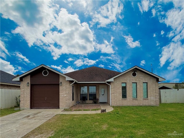 single story home featuring brick siding, an attached garage, fence, driveway, and a front lawn