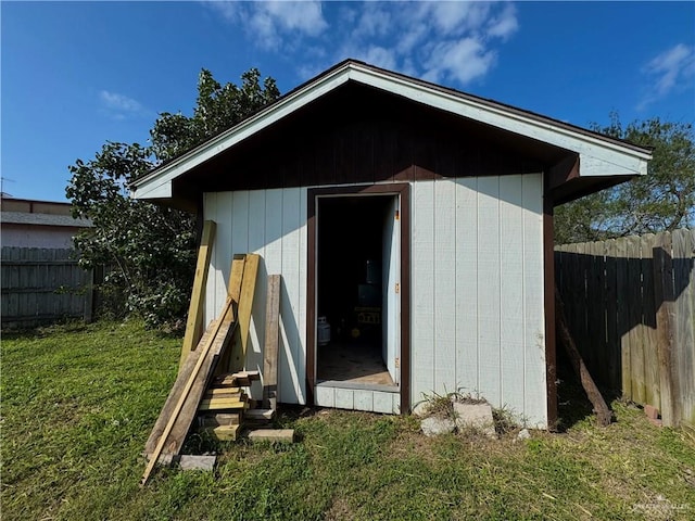 view of shed with fence