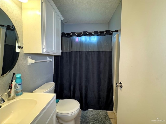 bathroom with toilet, a shower with curtain, tile patterned flooring, a textured ceiling, and vanity