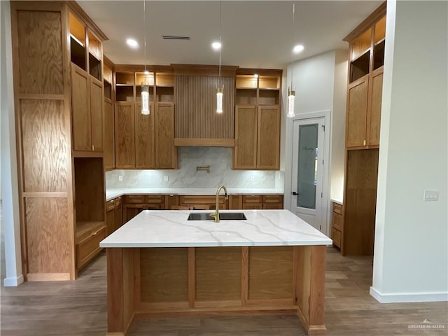 1513 Helen Dr, Weslaco, TX 78596 - kitchen with open shelves, a sink, backsplash, an island with sink, and recessed lighting