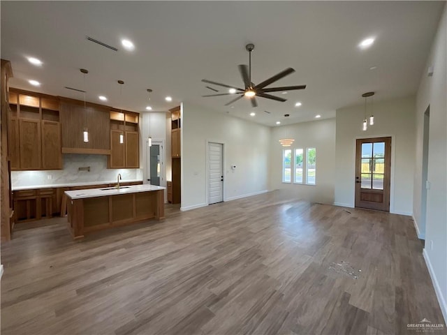 1513 Helen Dr, Weslaco, TX 78596 - kitchen with a sink, open floor plan, light wood-type flooring, a ceiling fan, and recessed lighting