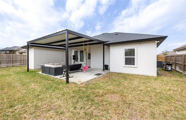 rear view of house with a fenced backyard, a patio, a lawn, and an outdoor hangout area