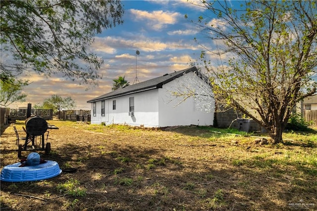 view of property exterior at dusk