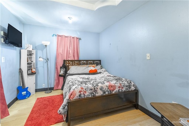 bedroom with light hardwood / wood-style flooring