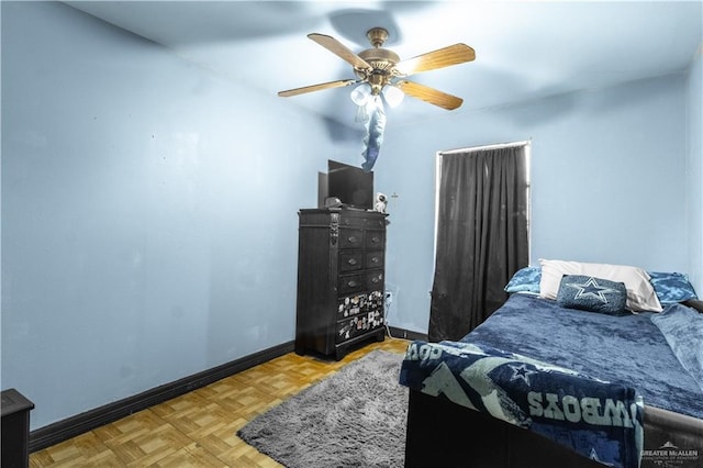 bedroom featuring ceiling fan and light parquet flooring