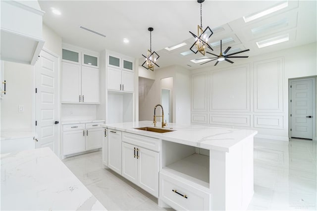 1608 Diplomat Dr, Edinburg, TX 78542 - kitchen with a sink, light marble finish flooring, a chandelier, white cabinets, and recessed lighting