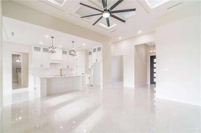 1608 Diplomat Dr, Edinburg, TX 78542 - kitchen with a sink, white cabinetry, recessed lighting, glass insert cabinets, and a spacious island